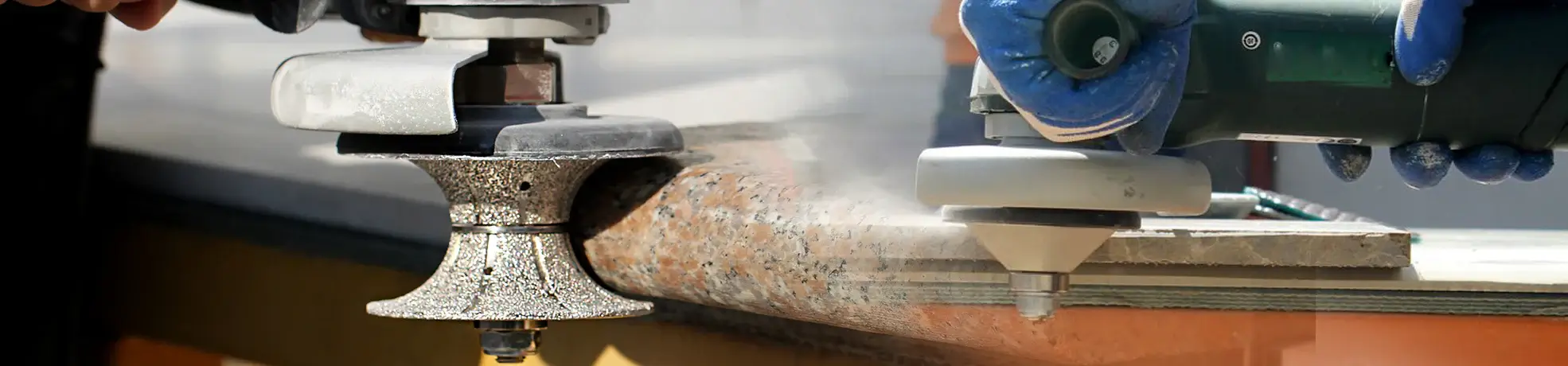 Metal-bonded diamond profiling wheel executing heavy stock removal and calibration on a stone edge