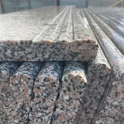 Heavy granite stair tread featuring anti-slip grooves and a polished half-bullnose edge