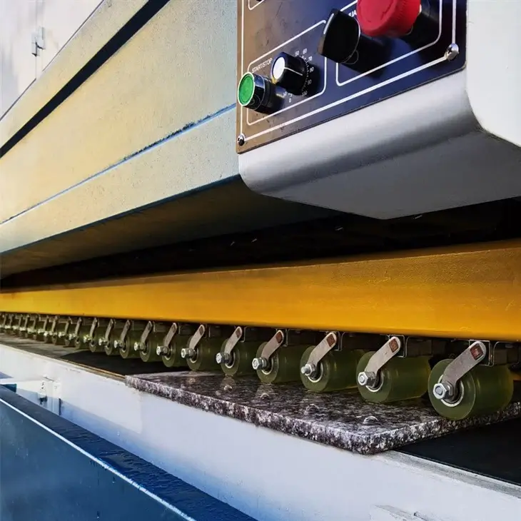 High-pressure hydro-cooling shield protecting a dark quartz countertop edge from resin burn during automatic linear polishing